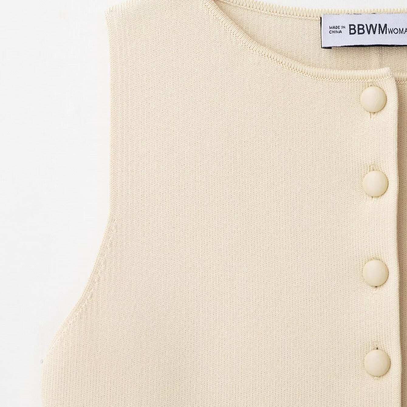 Round neck sleeveless single breasted waist cinched knit sweater for women